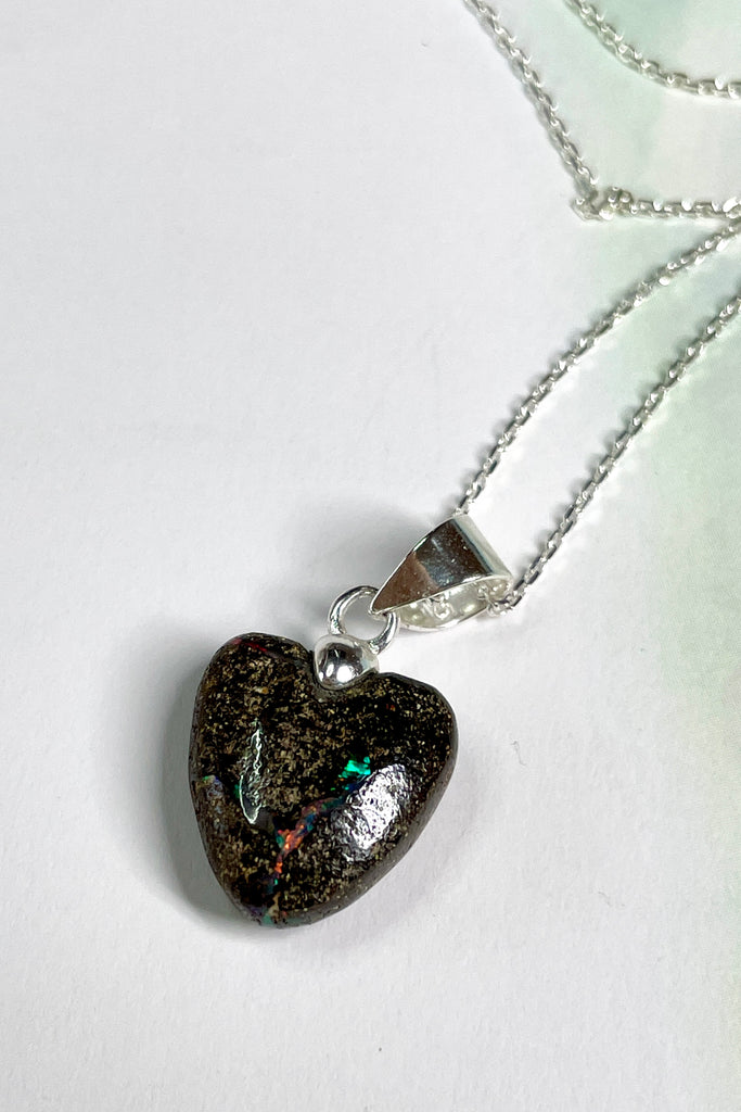 From our range of Australian opal heart pendants.  This intriguing piece of Boulder Opal was mined at Winton, then cut and polished for Mombasa Rose in Noosa, Queensland