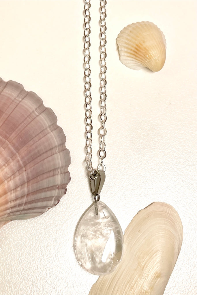 rock crystal droplet pendant is cut from natural stone.