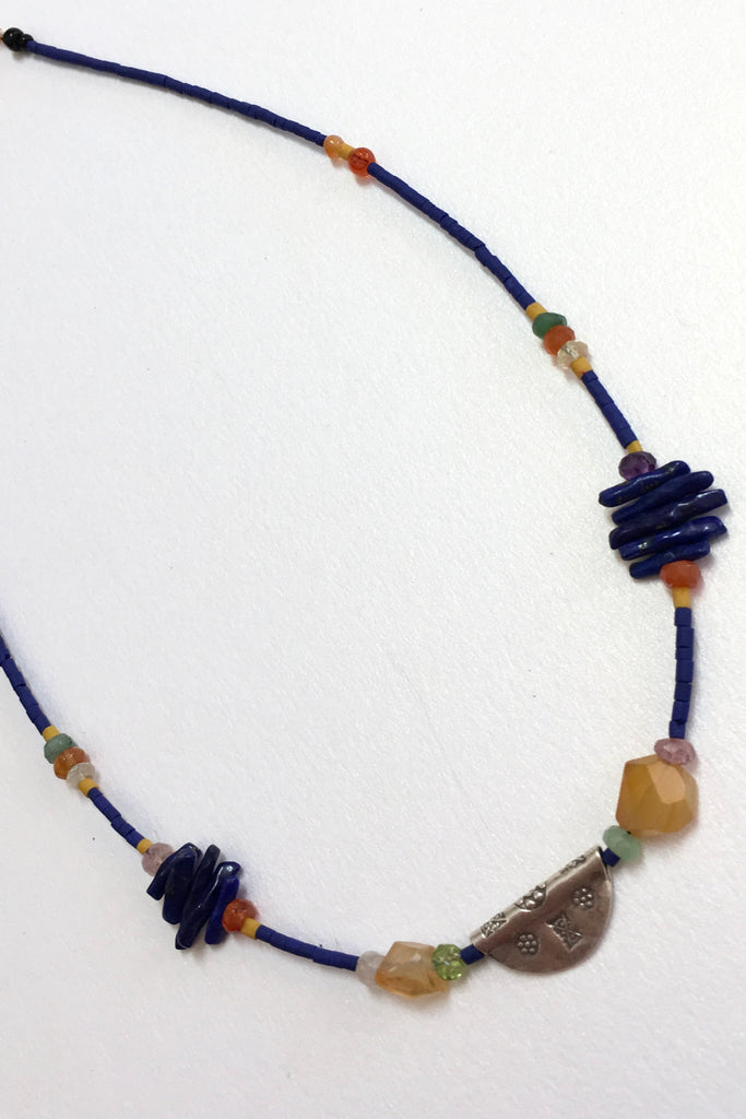 Necklace Cay Amulet with Lapis Lazuli is 40cm in length Beads include Lapis Lazuli, carnelian, faceted semi precious stone and Turkish glass beads.
