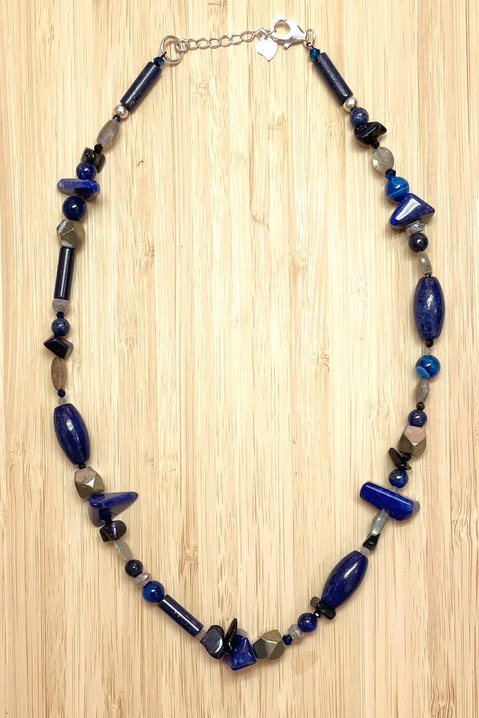 a sweet choker style hand made using an assortment of blue gemstones. These include Lapis Lazuli, Agate, Labradorite and natural Pyrite. 