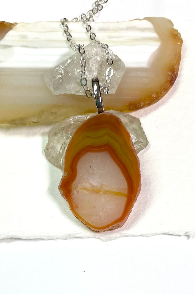  Australian stone pendant has been cut by an Australian fossicker, it is from Agate Creek. A fairly large piece, it has an oval window of crystalline quartz, 