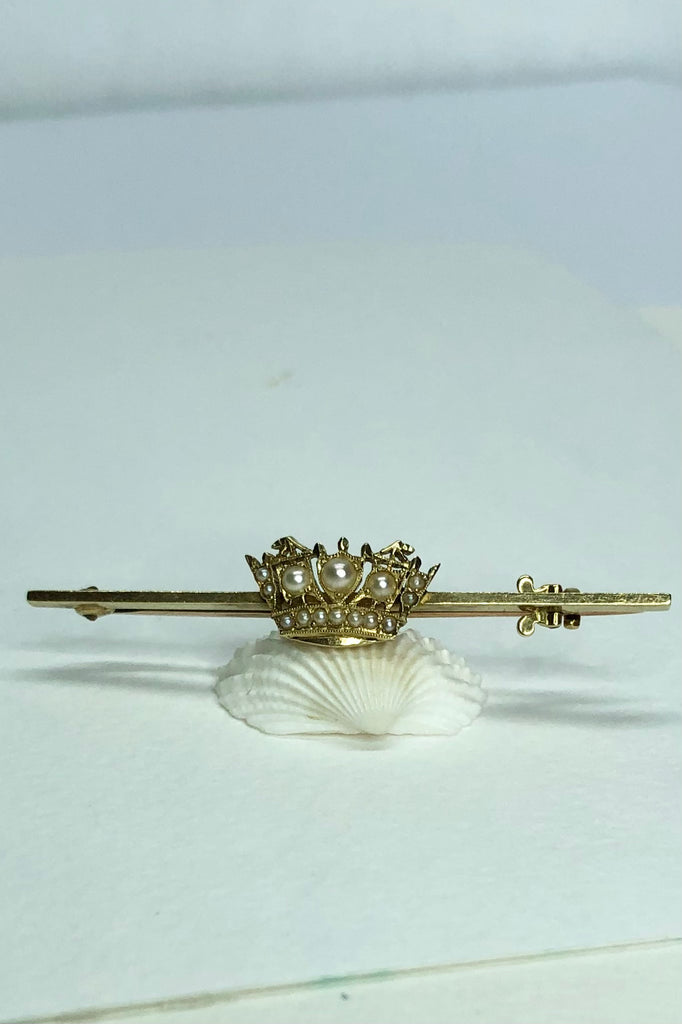 A Royal Navy & Merchant Services gold and pearl nautical crown sweetheart brooch, with 14 pearls set in 18 Carat gold,