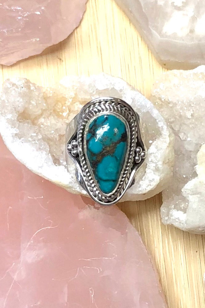 A heavy silver and dark turquoise ring featuring a natural Turquoise stone, in a 925 silver setting., perfect for boho lovers.