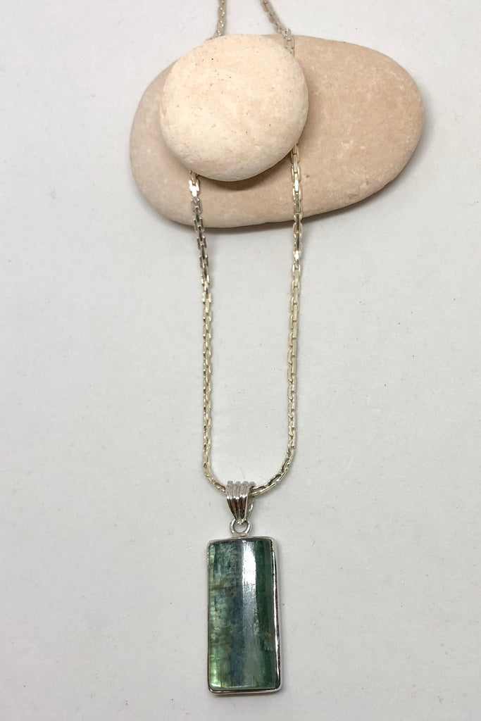 The Pendant of Kyanite on a Silver Chain 3 is a purity of a lovey natural crystal pendant polished to a high shine, 3cm length and 1cm width.