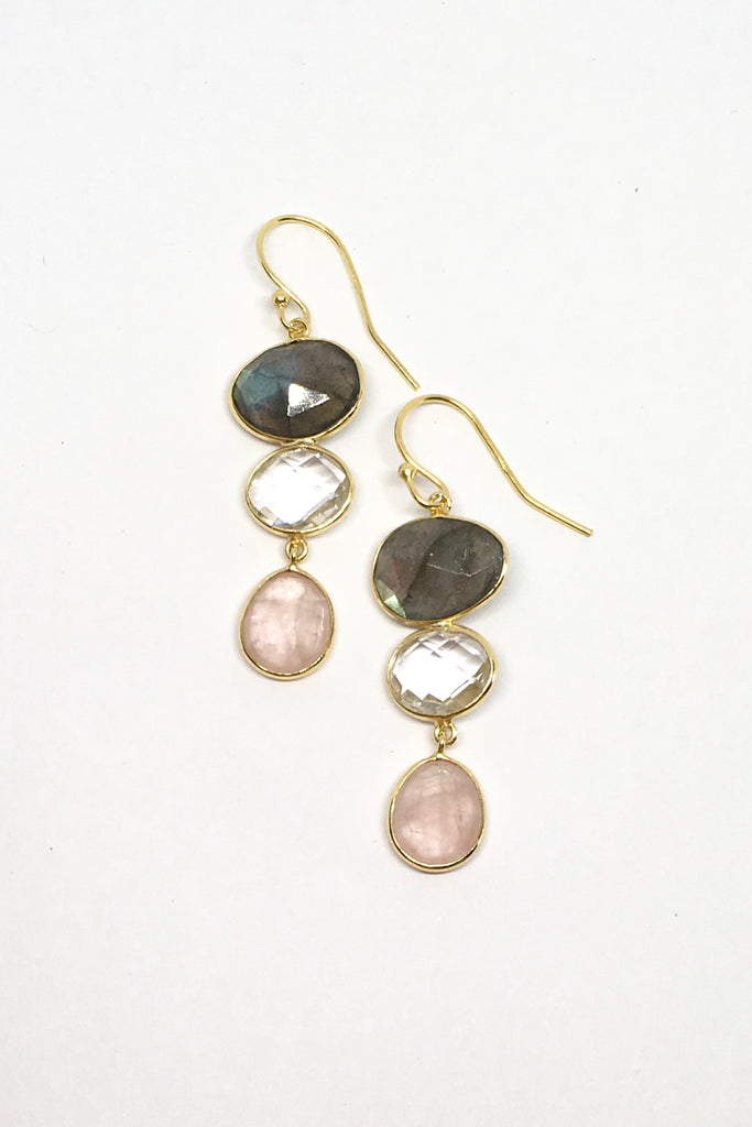 A modern bohemian inspired design of smokey toned crystal stones incased in gold vermeil