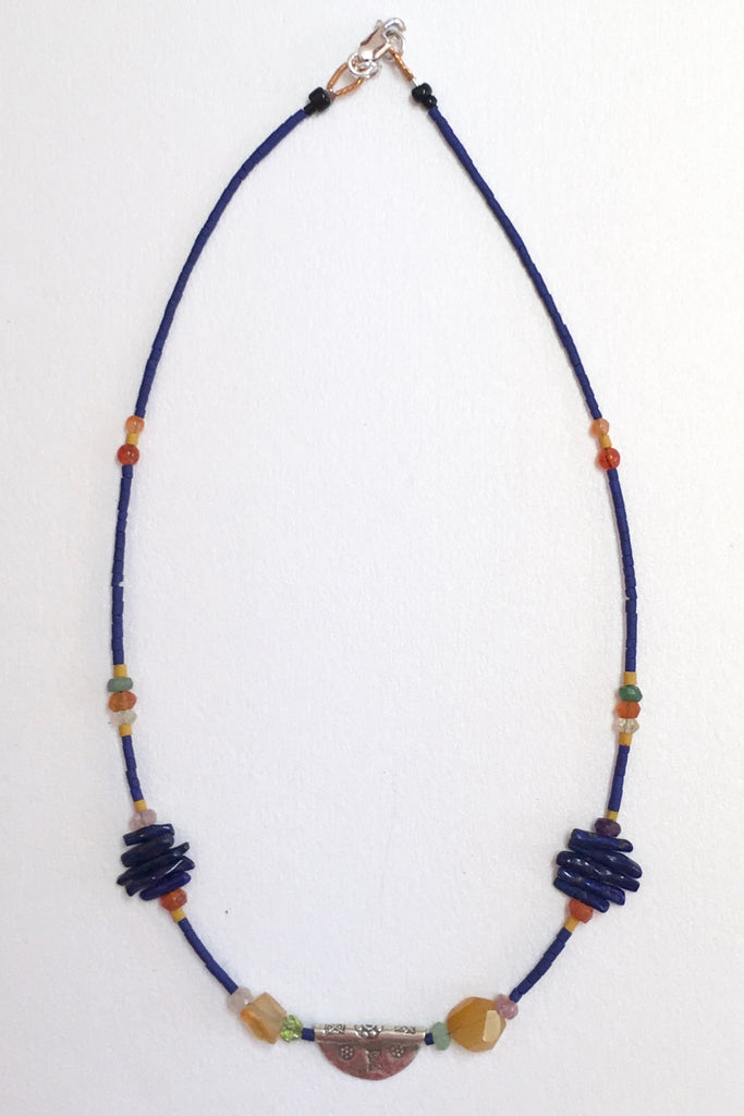 Necklace Cay Amulet with Lapis Lazuli is 40cm in length Beads include Lapis Lazuli, carnelian, faceted semi precious stone and Turkish glass beads.