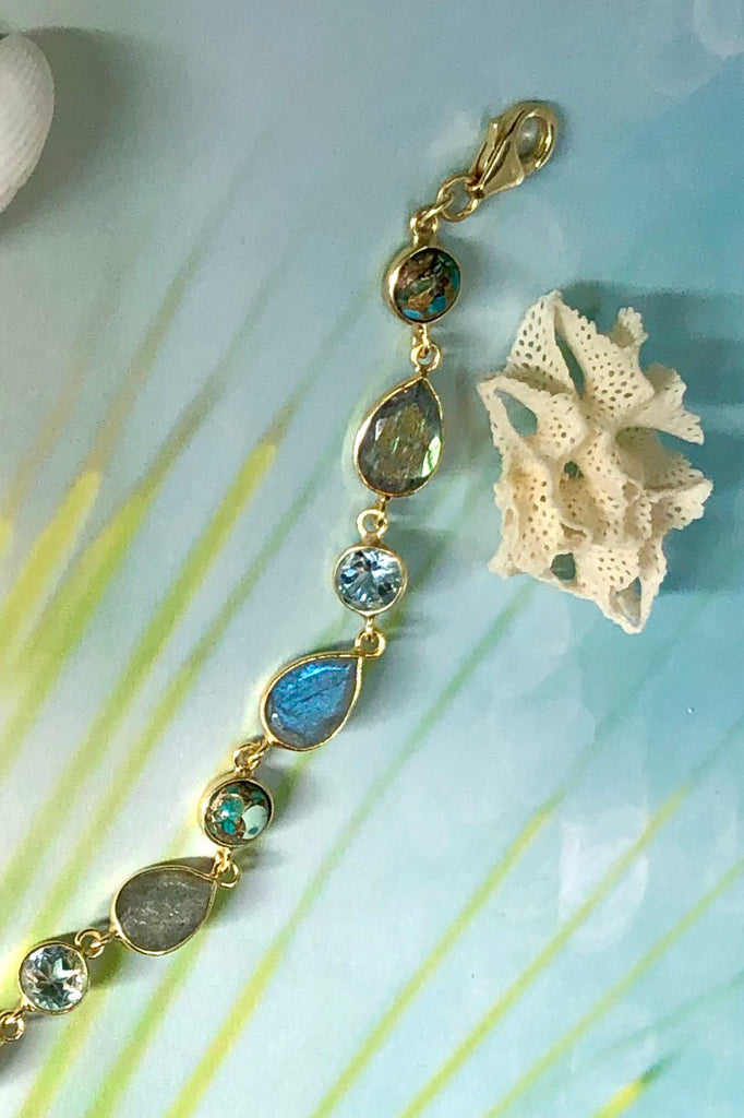 An ultra fine gold vermeil bracelet dotted with London blue Topaz, Labradorite and Turquoise composite.  