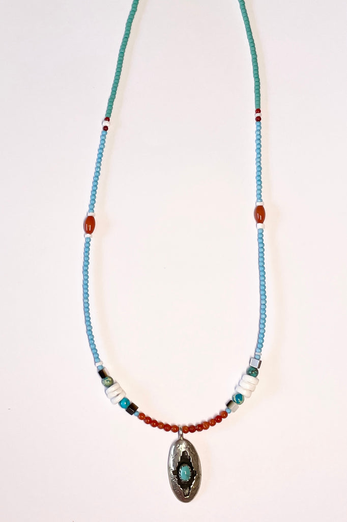 lovely choker style necklace has a sterling silver centre piece with a natural turquoise cabochon in the centre, it is stamped Moondance.