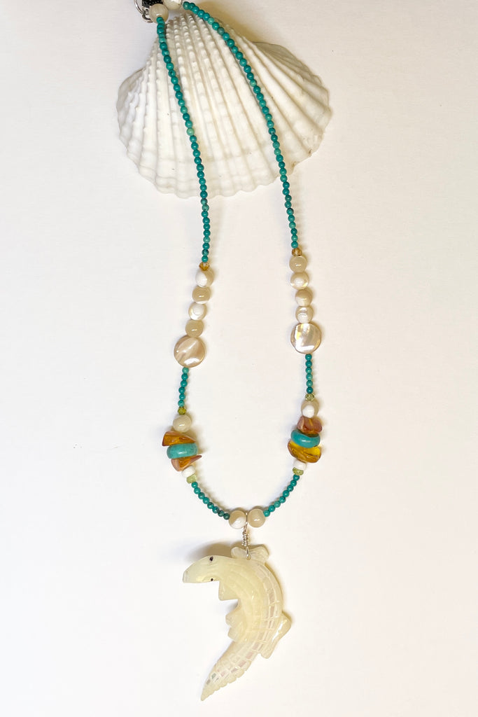 This necklace is a one off piece, the stones are all natural semi precious gems and mother of pearl shell. The crocodile is hand carved from a mother of pearl sea shell