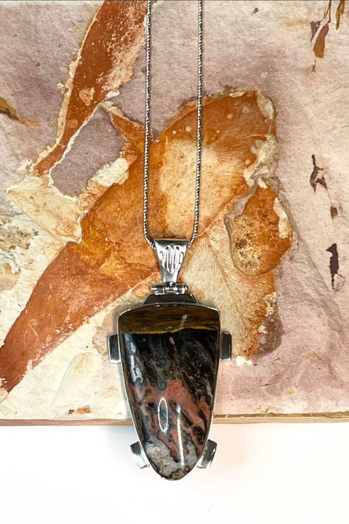 A powerful and intriguing Morrocan Jasper pendant reflecting the story of the ancient rock. A modernist setting in a unique design,