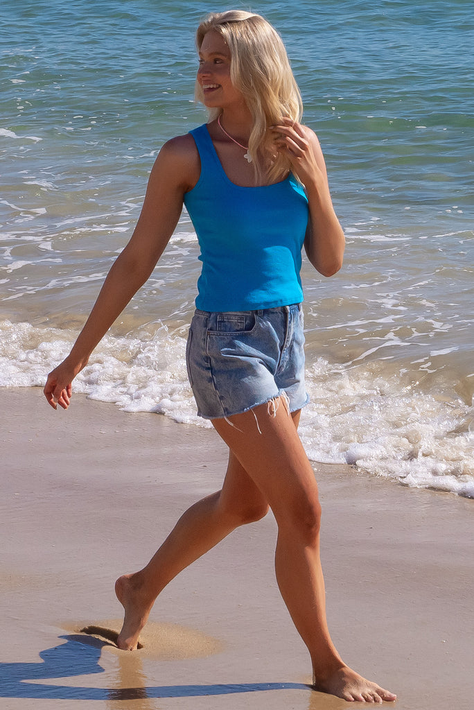 The Duo Sky Blue Tank Top is a luxurious sky blue coloured tank top. The tank top features a high quality knit cotton, stretchy fabric, ribbed texture and is fitted.