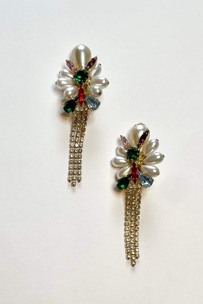 Fun clip on retro earrings featuring bright diamantes and faux pearls with diamante tassels