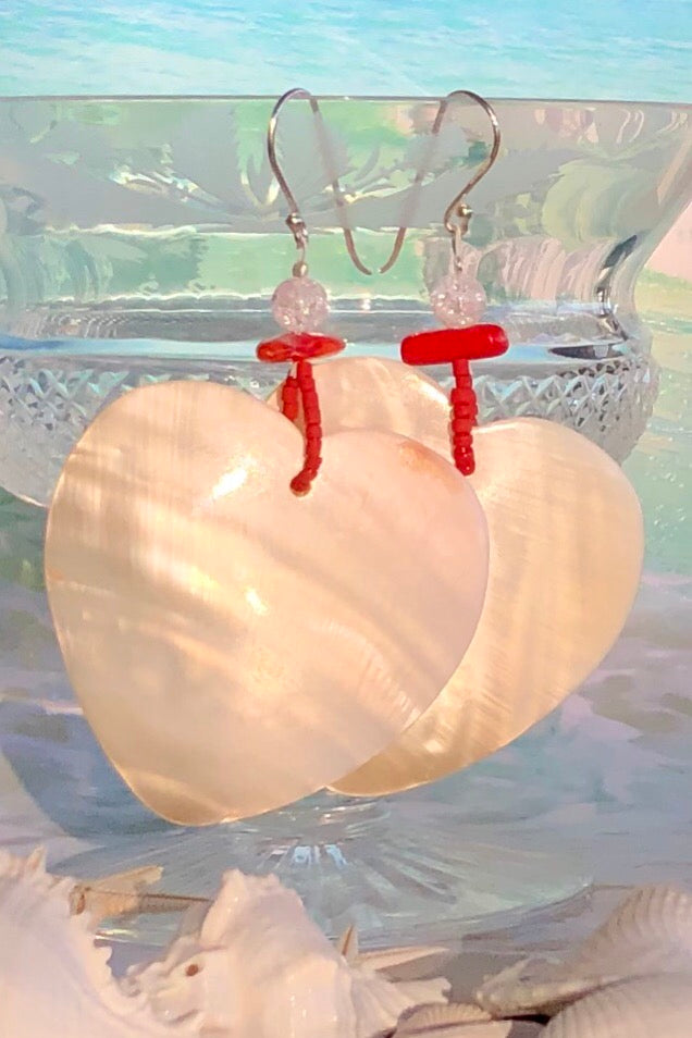 The polished Mother of Pearl shell has been hand cut into a heart shape then polished. The detal is of Red Bamboo coral, crackle rock crystal and handmade sand beads, the hook is silver.