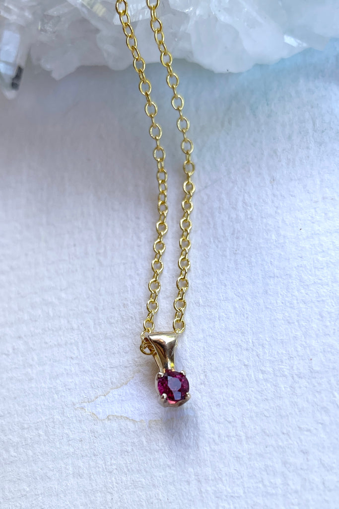 This adorable Luna pendant is made in 9ct gold, the stone is a lovely dark pink 3mm Tourmaline gemstone. A tiny delicate and sophisticated gemstone pendant.
