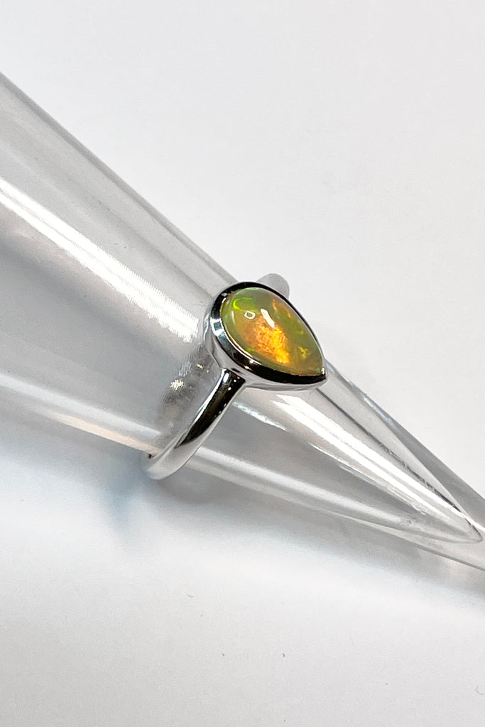 A pretty and luminescent opal gemstone, this darling and dainty little ring is simply perfection, the opal is from Ethopia in Africa, the flashes of colour are so pretty.