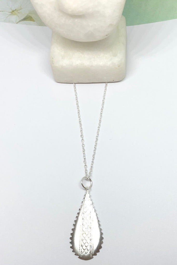 Silver pendant designed in African chic modern style.