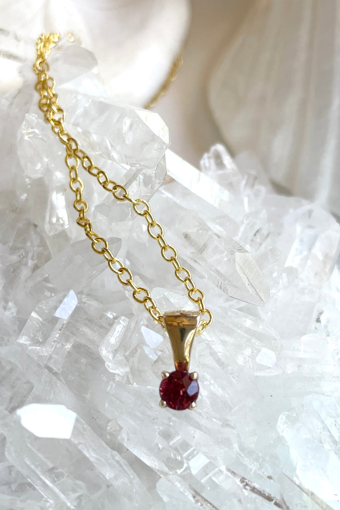 This adorable Luna pendant is made in 9ct gold, the stone is a lovely dark pink 3mm Tourmaline gemstone. A tiny delicate and sophisticated gemstone pendant.