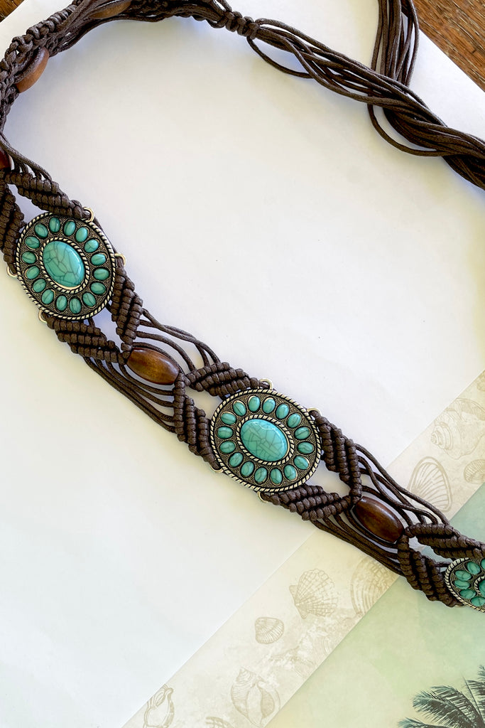 a macrame knotted and beaded belt embellished with turquoise beaded conch detail. 