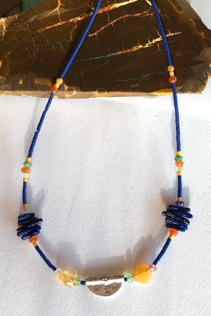 Necklace Cay Amulet with Lapis Lazuli is 40cm in length Beads include Lapis Lazuli, carnelian, faceted semi precious stone and Turkish glass beads.