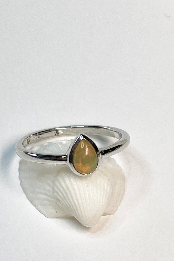 A pretty and luminescent opal gemstone, this darling and dainty little ring is simply perfection, the opal is from Ethopia in Africa, the flashes of colour are so pretty.