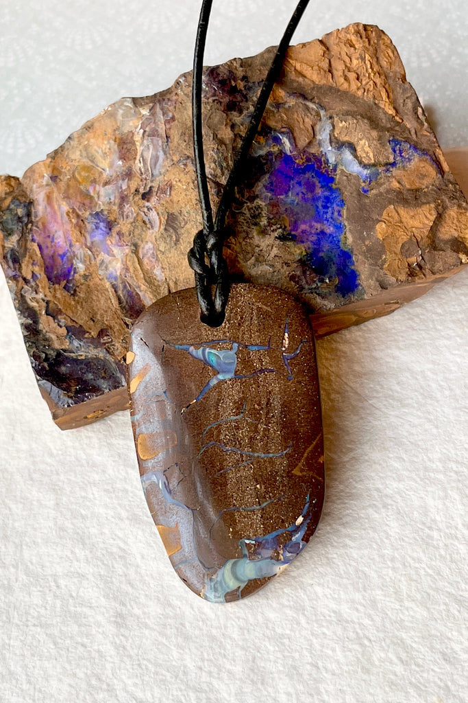  The opal pendant is cut as a freeform rectangle, the colours and rock formations of the material from which it was cut are so beautiful, a secret to the past of the country Australia.  