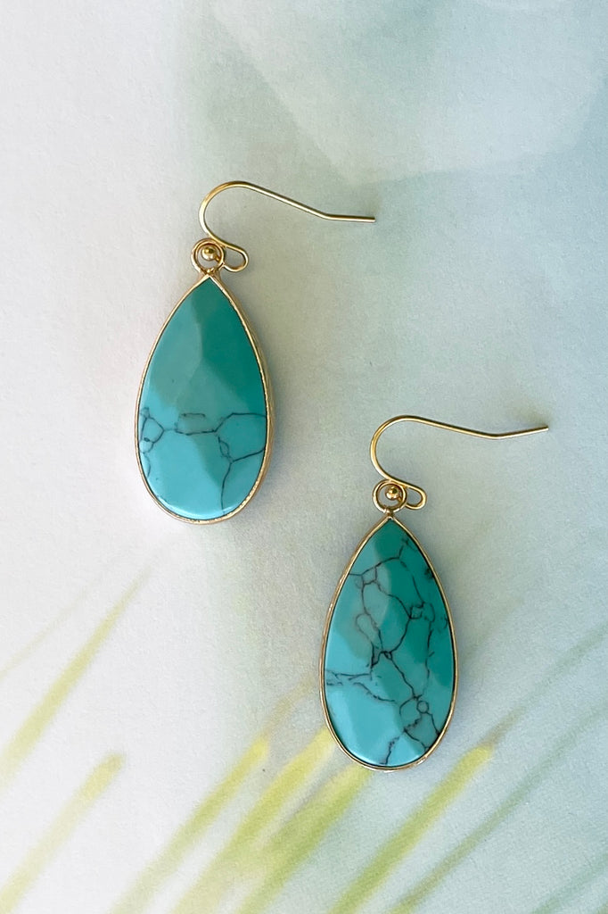 These earrings in Turquoise simulant are bezel set in gold tone, a perfect summer boho style.