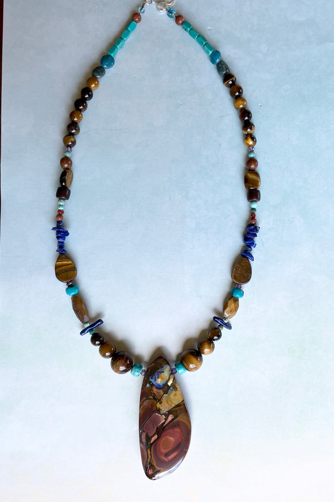 This necklace has been designed using natural Opal and many different semi precious gemstones