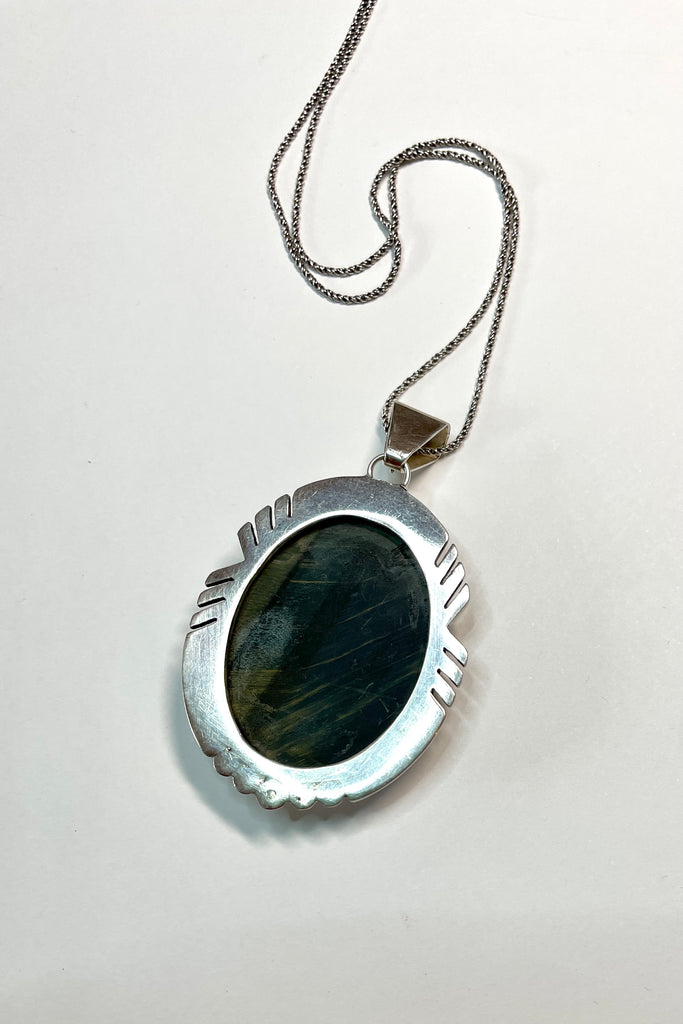 A modernist pendant in a unique design, the blue Labradorite stone was cut and faceted by a local