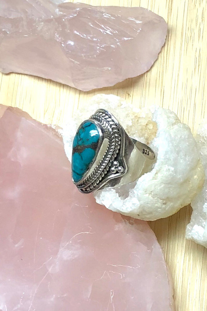 A heavy silver and dark turquoise ring featuring a natural Turquoise stone, in a 925 silver setting., perfect for boho lovers.