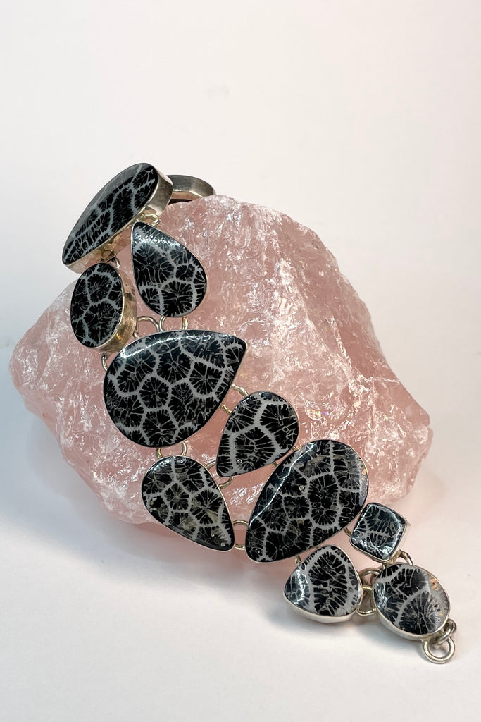 lovely Smokey silver grey mother of pearl bracelet, each shape has been individually set and rim set into heavy 925 silver. A very pretty and well made bracelet.