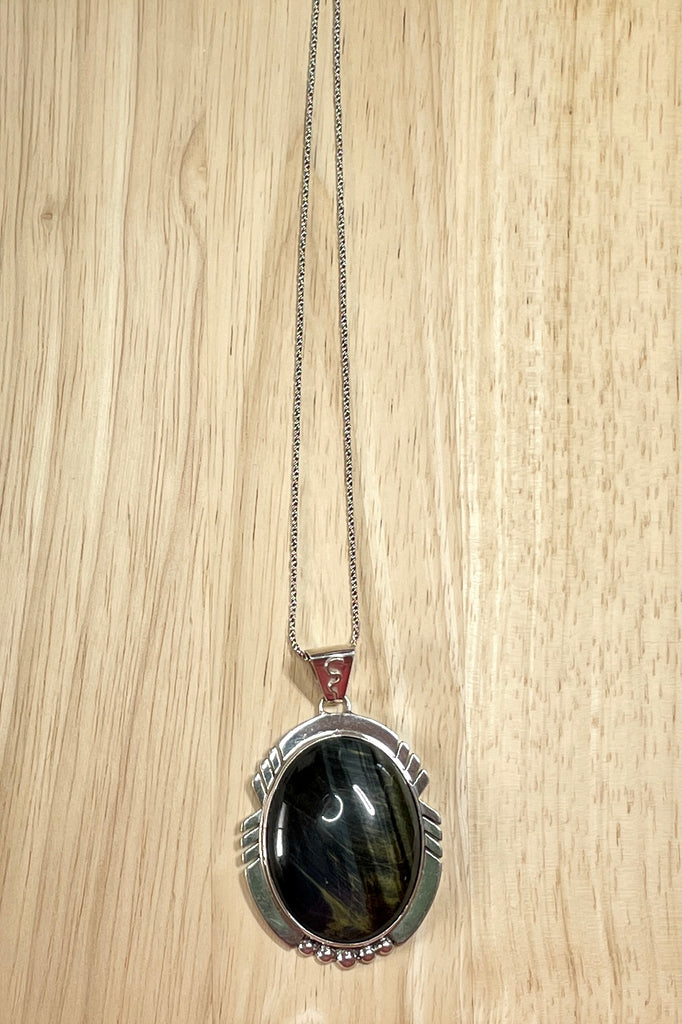 A modernist pendant in a unique design, the blue Labradorite stone was cut and faceted by a local 