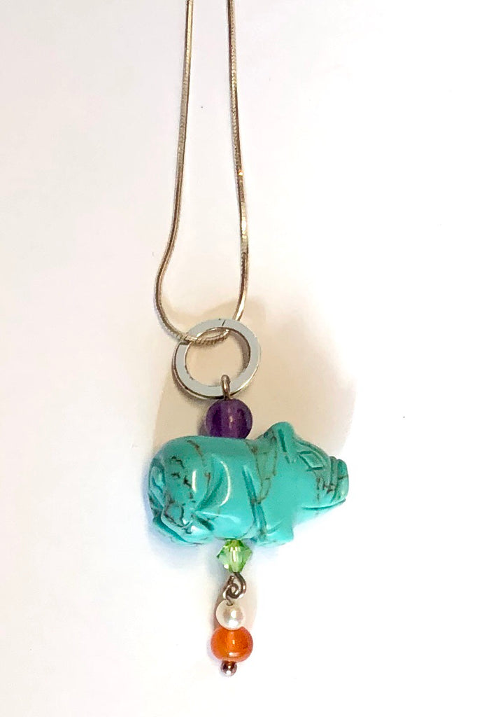 Pendant tiny Howlite Pig on Silver Chain features pig shape turquoise dyed Howlite gemstone with an amethyst top bead, Carnelian and pearl bead with a green crystal bead.