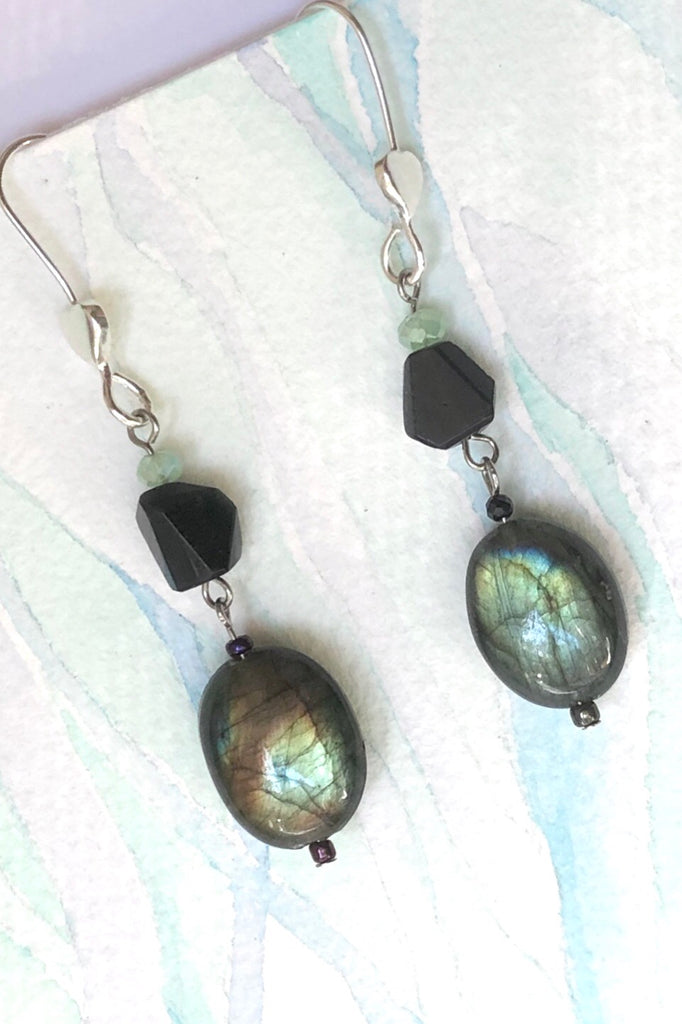 The Serendipity Earrings Labradorite Eve are handmade in Noosa featuring  Natural black onyx bead, Oval Labradorite bead, Green Quartz bead and  hook is 925 Silver.