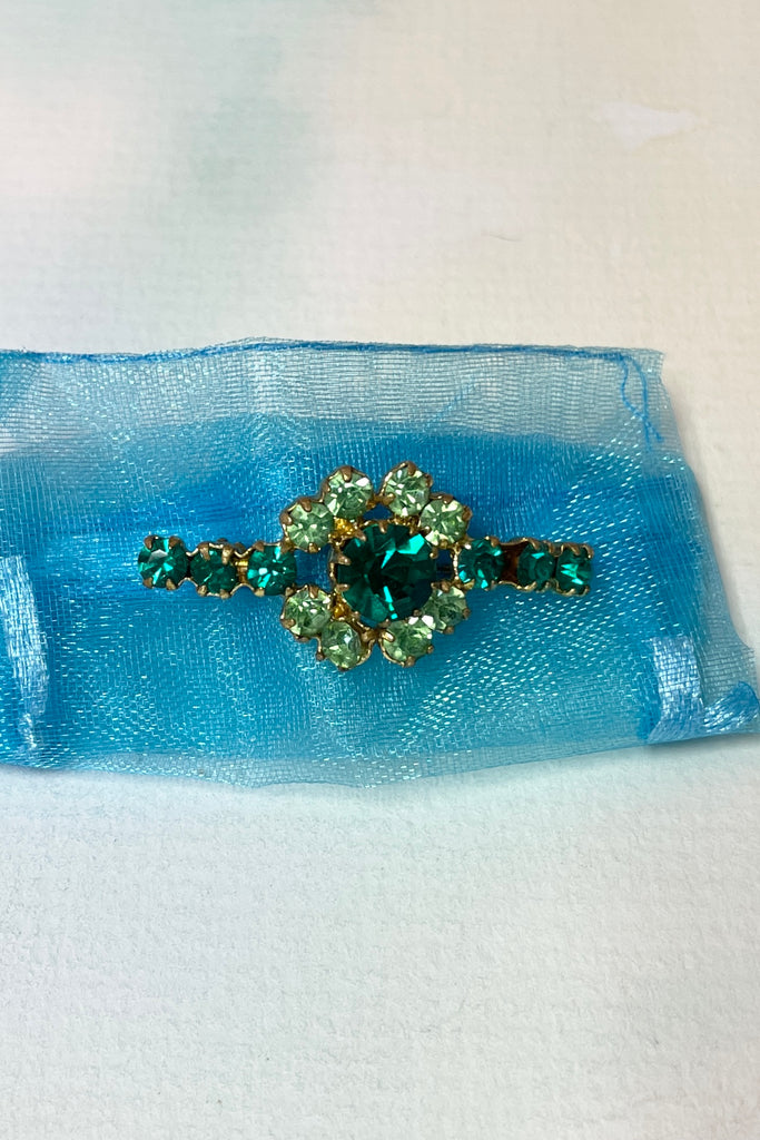 The green crystals in this sweet old brooch are an intense bright emerald green and an apple green, with no wear or scratching.