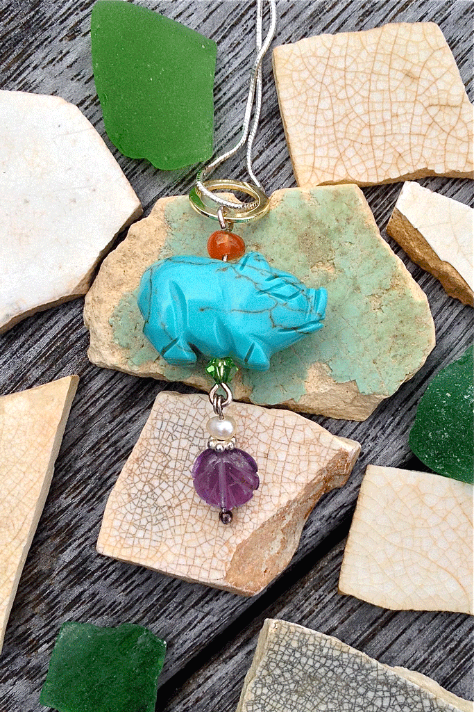 Pendant tiny Howlite Pig on Silver Chain features pig shape turquoise dyed Howlite gemstone with an amethyst top bead, Carnelian and pearl bead with a green crystal bead.