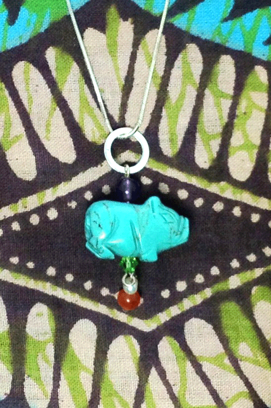 Pendant tiny Howlite Pig on Silver Chain features pig shape turquoise dyed Howlite gemstone with an amethyst top bead, Carnelian and pearl bead with a green crystal bead.