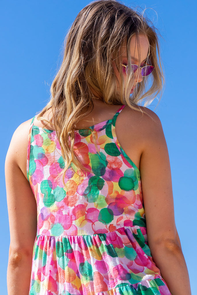 Our luxurious Lulu Darling Dress in a bright and bubbly green, pink and yellow print. This style features a high neck with thin straps, high cut under arms, full tiered skirting from the bust down and deep side pockets. Made from a woven cotton/rayon blend.