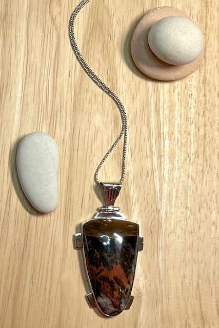 A powerful and intriguing Morrocan Jasper pendant reflecting the story of the ancient rock. A modernist setting in a unique design,