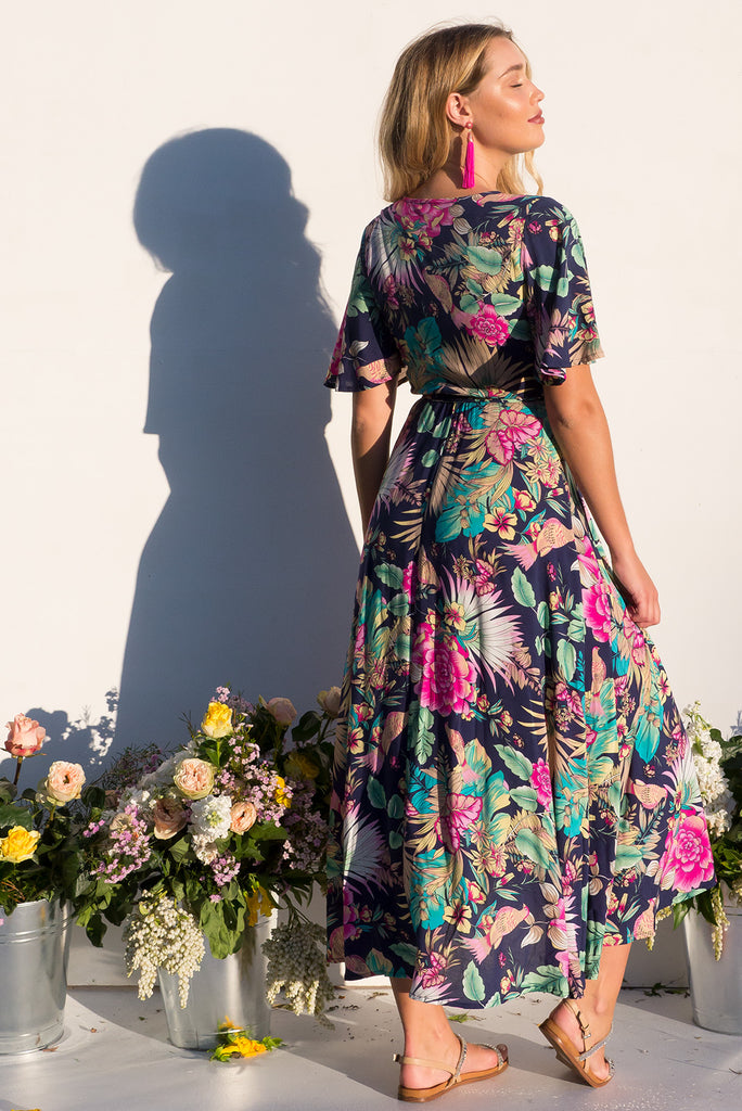 Petal Bird of Paradise Maxi Wrap dress with flutter sleeves in a vibrant navy and brightly coloured tropical print plus size dress