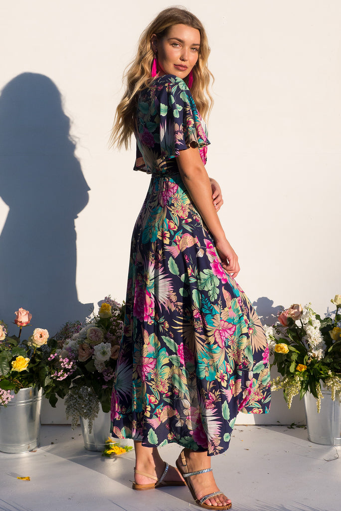 Petal Bird of Paradise Maxi Wrap dress with flutter sleeves in a vibrant navy and brightly coloured tropical print plus size dress