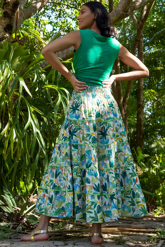 For a luxe look you're sure to adore we recommend the Rozita Green Jungle Tiered Maxi Skirt. The luscious green, leafy print featuring exotic animals will have you daydreaming of a warm tropical holiday. Cotton, Lightweight, shirred waistband, slip-on style, pockets, ric rac feature.