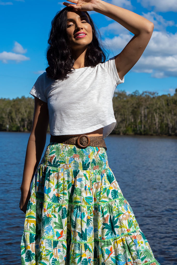 For a luxe look you're sure to adore we recommend the Rozita Green Jungle Tiered Maxi Skirt. The luscious green, leafy print featuring exotic animals will have you daydreaming of a warm tropical holiday. Cotton, Lightweight, shirred waistband, slip-on style, pockets, ric rac feature.