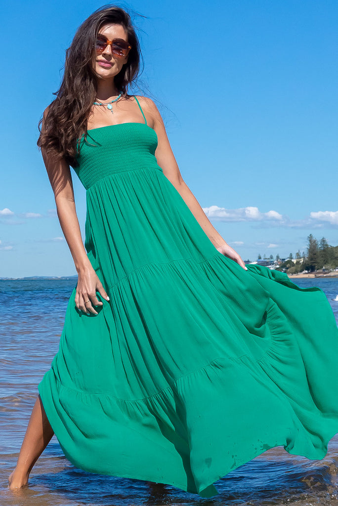 The Stardust Killarney Green Maxi Dress is a luxurious deep sea green maxi dress in a crinkle textured cheesecloth fabric. The dress is lightweight and features an elasticated shirred bodice, tiered skirt and side pockets. Made from 100% woven rayon.