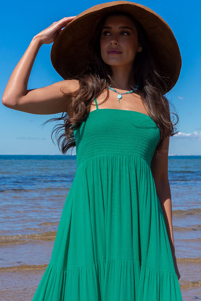The Stardust Killarney Green Maxi Dress is a luxurious deep sea green maxi dress in a crinkle textured cheesecloth fabric. The dress is lightweight and features an elasticated shirred bodice, tiered skirt and side pockets. Made from 100% woven rayon.