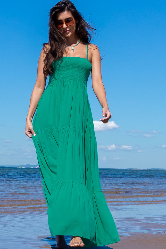 The Stardust Killarney Green Maxi Dress is a luxurious deep sea green maxi dress in a crinkle textured cheesecloth fabric. The dress is lightweight and features an elasticated shirred bodice, tiered skirt and side pockets. Made from 100% woven rayon.