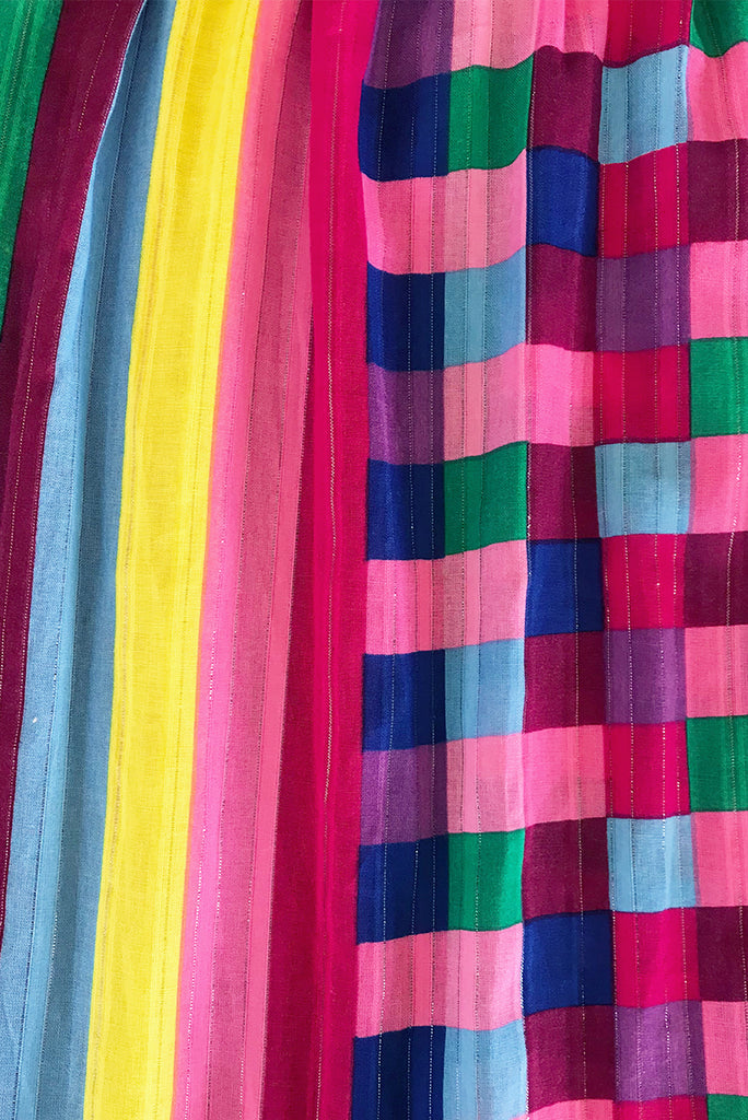 Fabric Swatch of Valencia Carnivale Maxi Skirt featuring a lurex thread running through it for a touch of summer sparkle, woven fabric 95% cotton 5% poly in bright multicoloured stripe and check print.