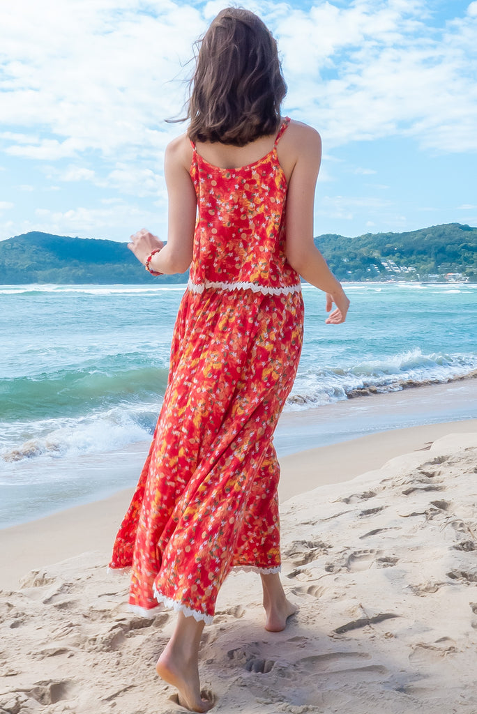 The Valentine Summer Sun Half Circle Maxi Skirt is a gorgeous maxi skirt with a red wash effect base and a fruit vine print. The skirt features and elasticated waistband, side pockets, half circle cut, lace detail on hem and is a slip on design. Made from a woven cotton/rayon blend.