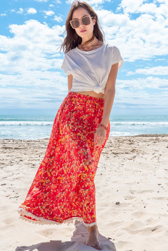 The Valentine Summer Sun Half Circle Maxi Skirt is a gorgeous maxi skirt with a red wash effect base and a fruit vine print. The skirt features and elasticated waistband, side pockets, half circle cut, lace detail on hem and is a slip on design. Made from a woven cotton/rayon blend.