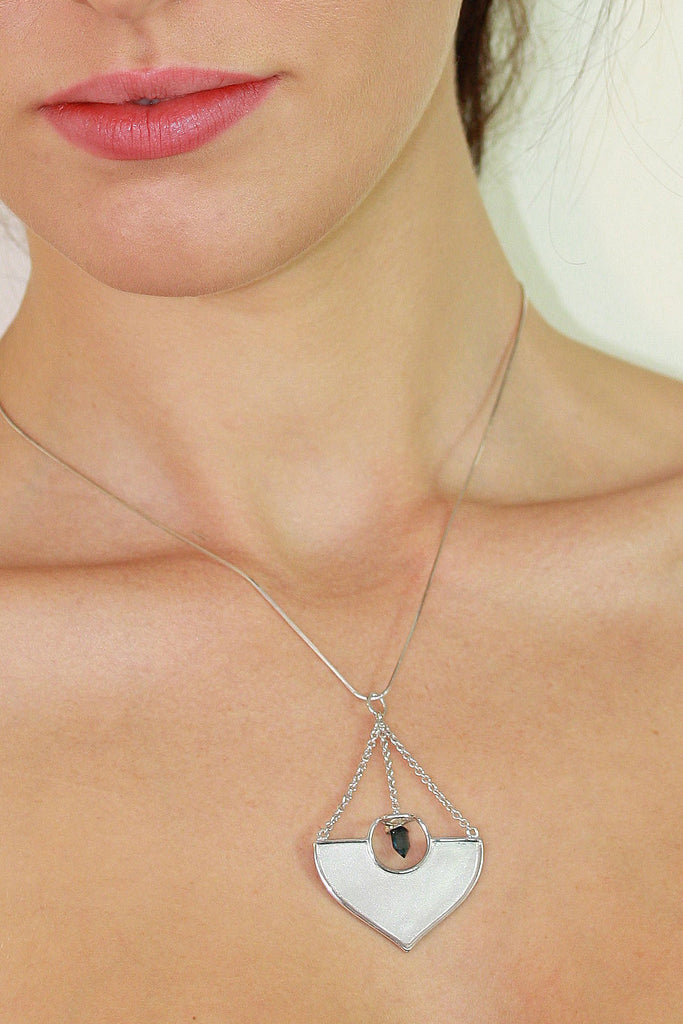 A stunning African Style 925 silver pendant with a Tourmaline Shard which hangs perfectly through a silver circle.