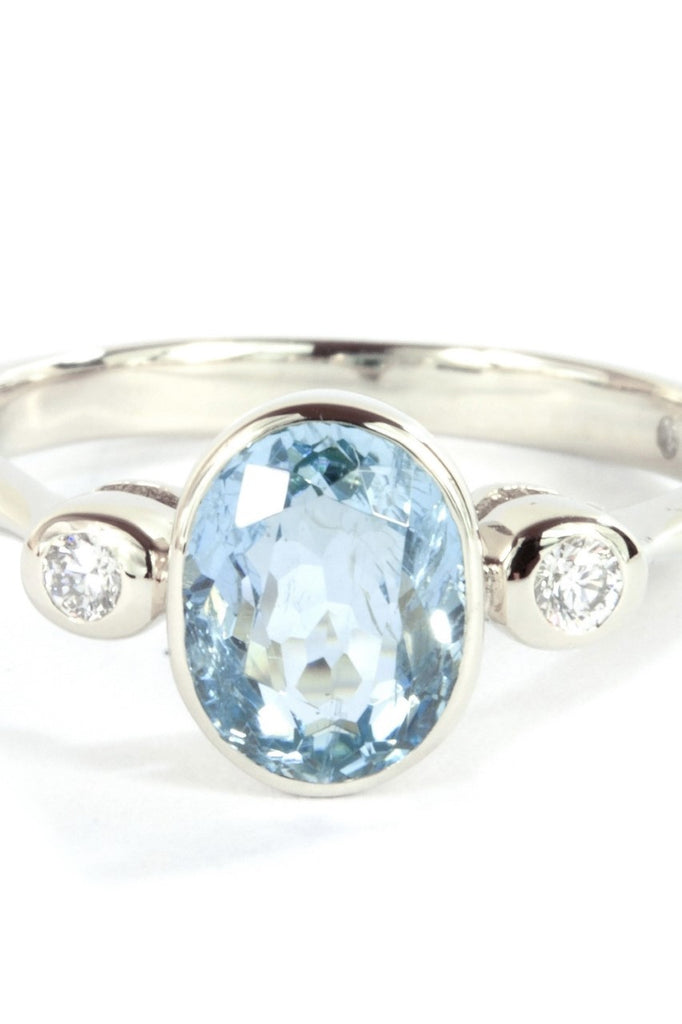  This classically styled ring holds a magnificent 8x6mm 1ct+ completely natural and unheated Mozambique Aquamarine with a sparkling 0.03ct F-G VS diamond on either side.